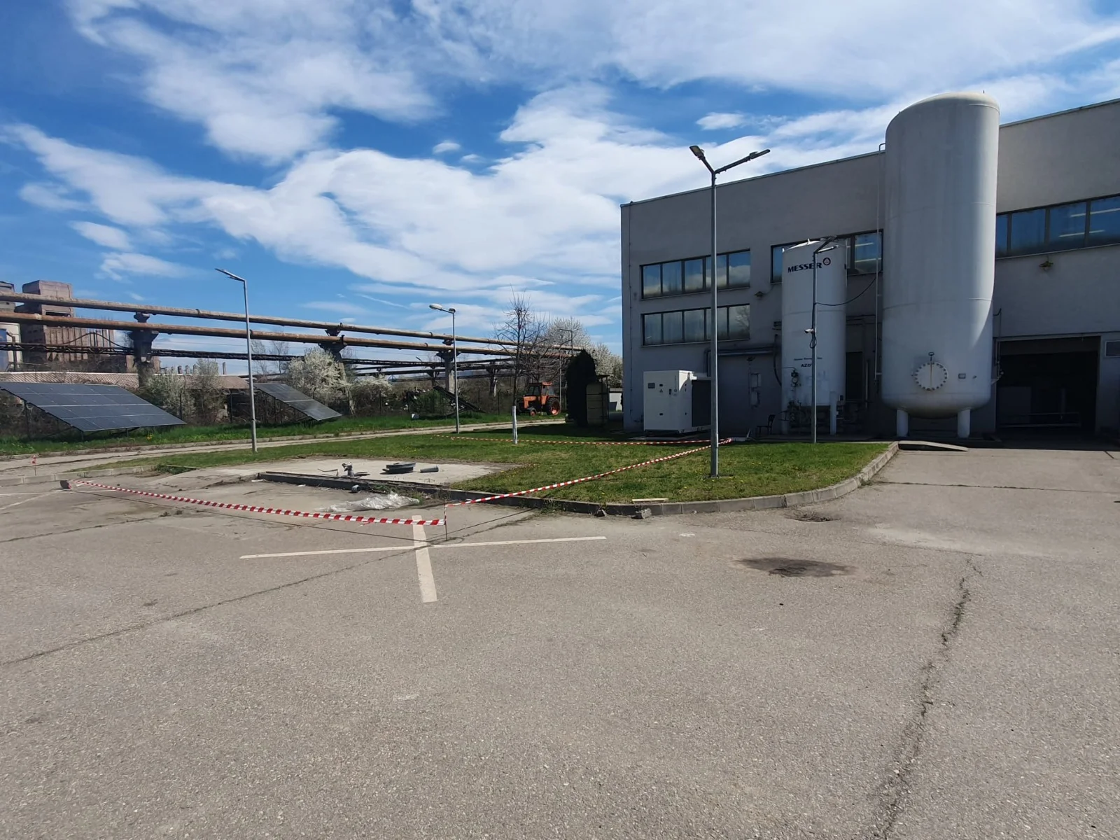 Building C industrial facility with storage tank and solar panels